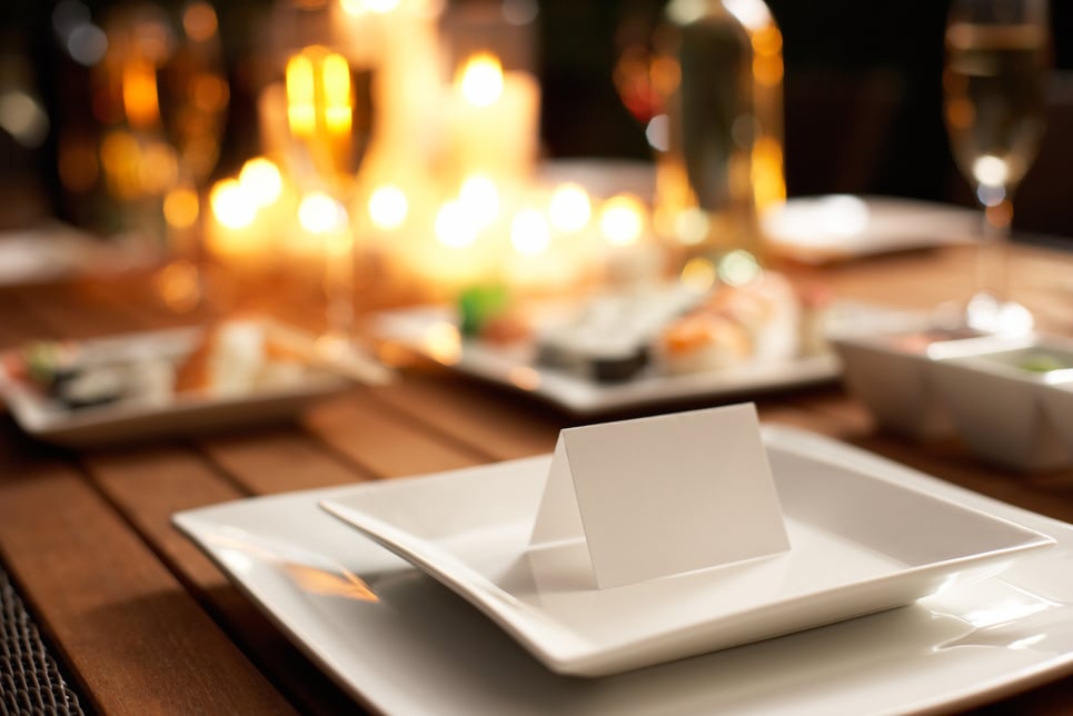 Place card on table set for dinner party